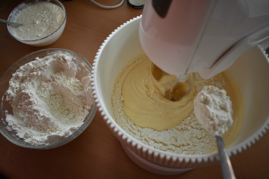 Add-flour-to-egg-yolk-and-white-SunCakeMom
